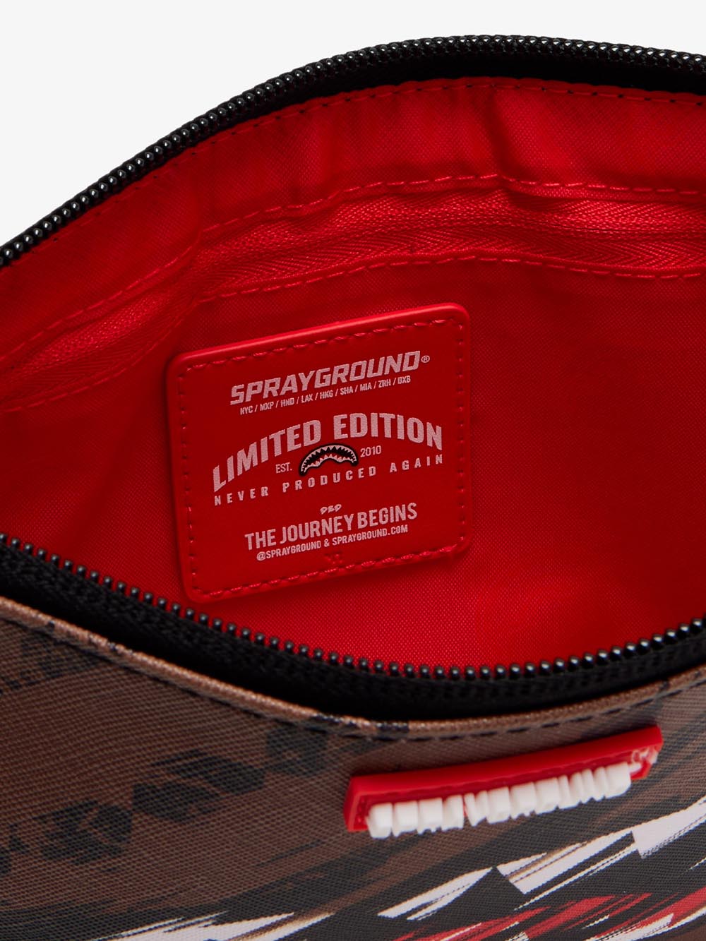 smeared grunge crossover clutch Sprayground Pochette Uomo 910b8969nsz Marrone